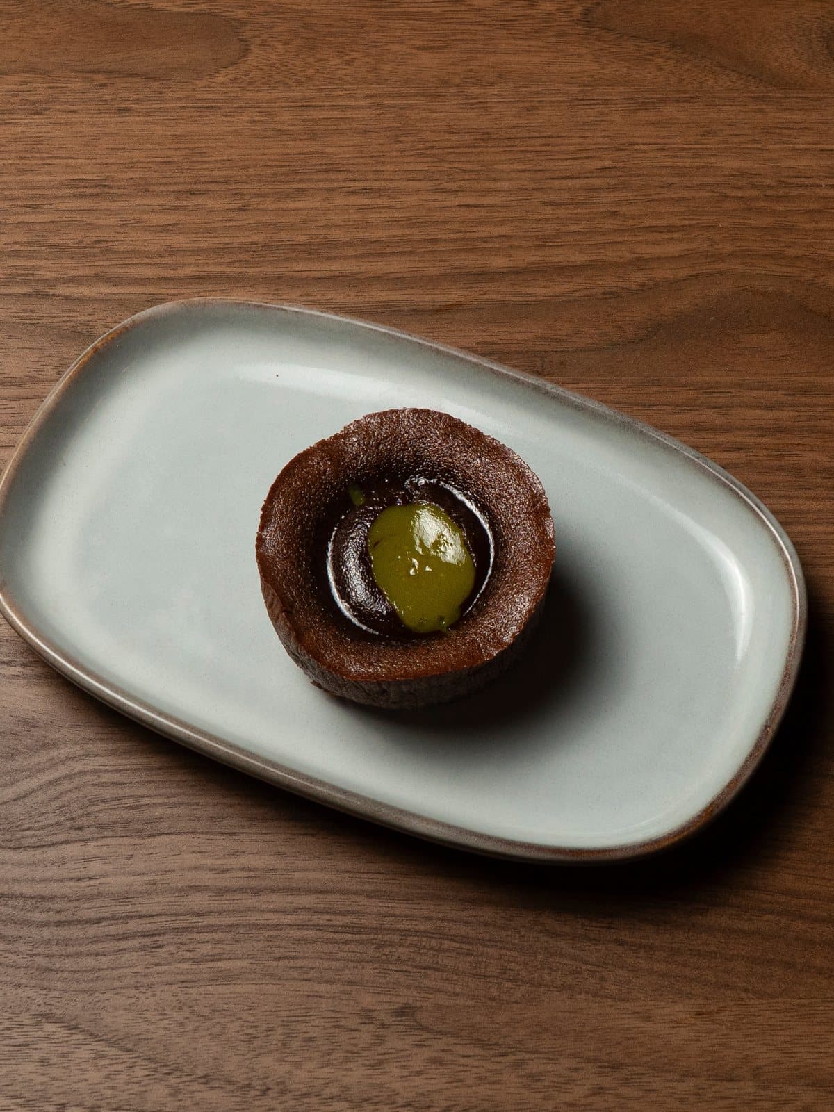 Coulant de pistacho con el corazón fundido